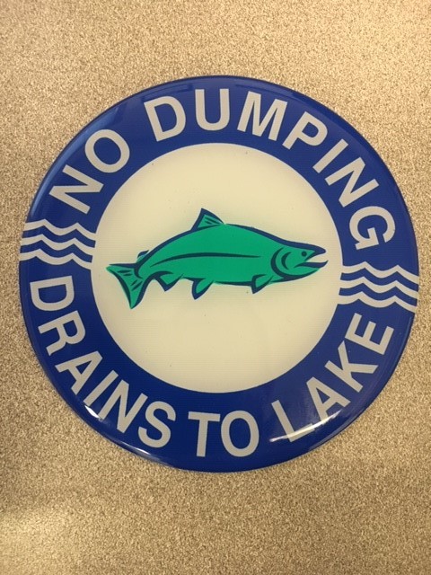 No dumping, drains to lake